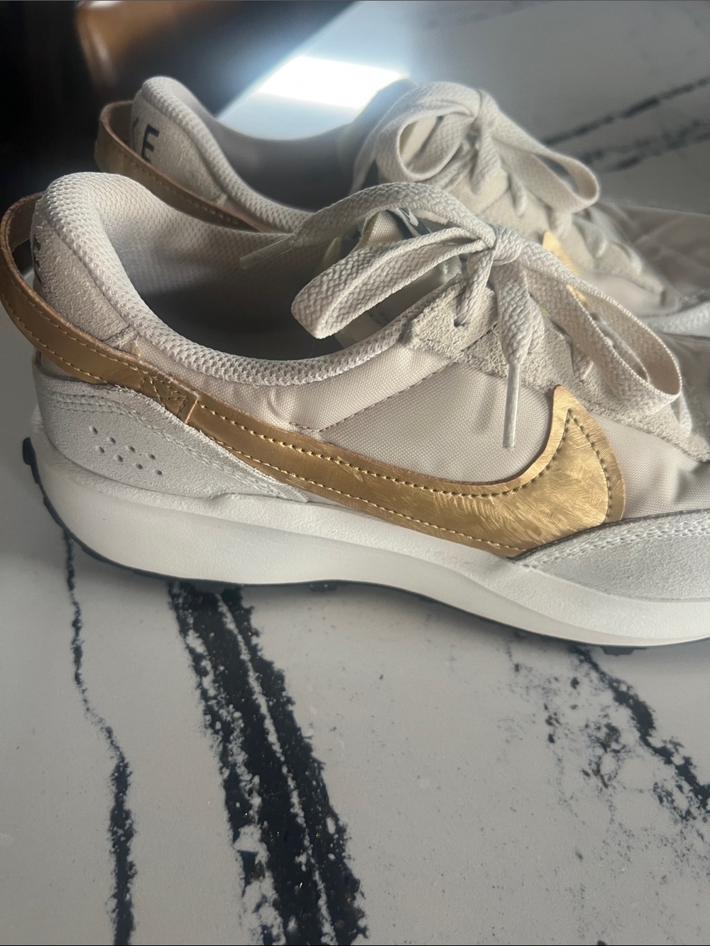 Nike Women's Cream Low-Top Sneakers with Gold Swoosh